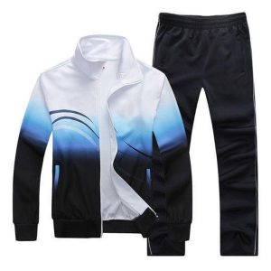 White and blue gradient men’s tracksuit set with zip-up jacket and matching pants.