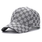 Grey monogram baseball cap with luxury-inspired pattern and curved brim.