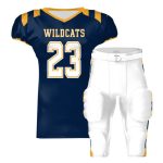 Navy football jersey with “WILDCATS” and number 23 paired with white padded football pants.