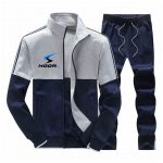 Navy blue and grey color block men’s tracksuit set with zip-up jacket and drawstring pants.