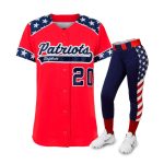 Patriotic women’s softball uniform featuring red jersey with stars and navy pants with American flag side design.