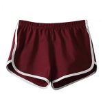 Women’s maroon retro running shorts with white trim and elastic waistband.