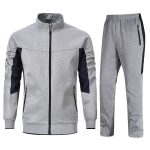 Grey men’s tracksuit set with black panels, zip-up jacket, and matching jogger pants.
