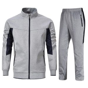 Grey men’s tracksuit set with black panels, zip-up jacket, and matching jogger pants.