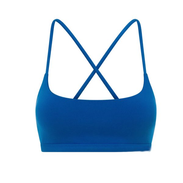 Ocean blue seamless sports bra with thin crisscross straps for gym and yoga.