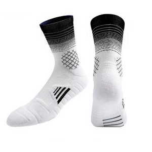 Pair of white and black cushioned gradient performance crew socks with arch support.
