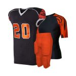 Black football jersey with orange number 20, tiger stripe compression shirt, and orange padded football pants.