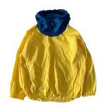 Yellow windbreaker jacket with blue hood, lightweight men’s outdoor jacket.