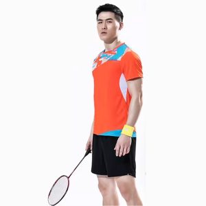 Men's orange and blue badminton sports t-shirt set with black shorts, holding a racket.