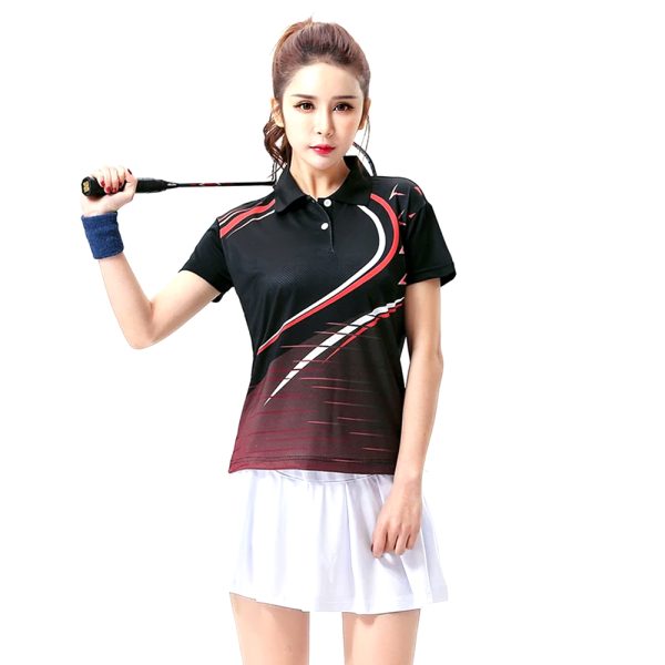 Women's black polo-style badminton shirt with red design, paired with a white athletic skirt.
