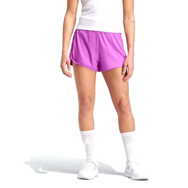 Woman wearing bright pink striped running shorts with a curved hem and athletic fit.